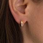 Pink Crystal Huggie Pierced Earrings

Yellow Gold Plated
Cubic Zirconia
0.5" Diameter