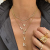 Diamond heart necklace layered with other yellow gold & diamond necklaces