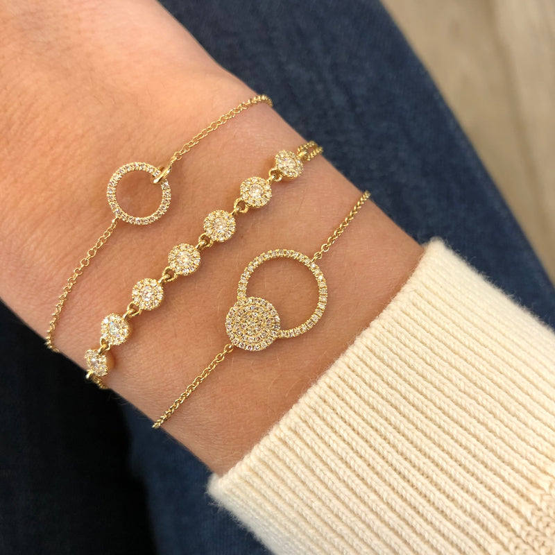 Diamond circle bracelet paired with circular pave bracelets
