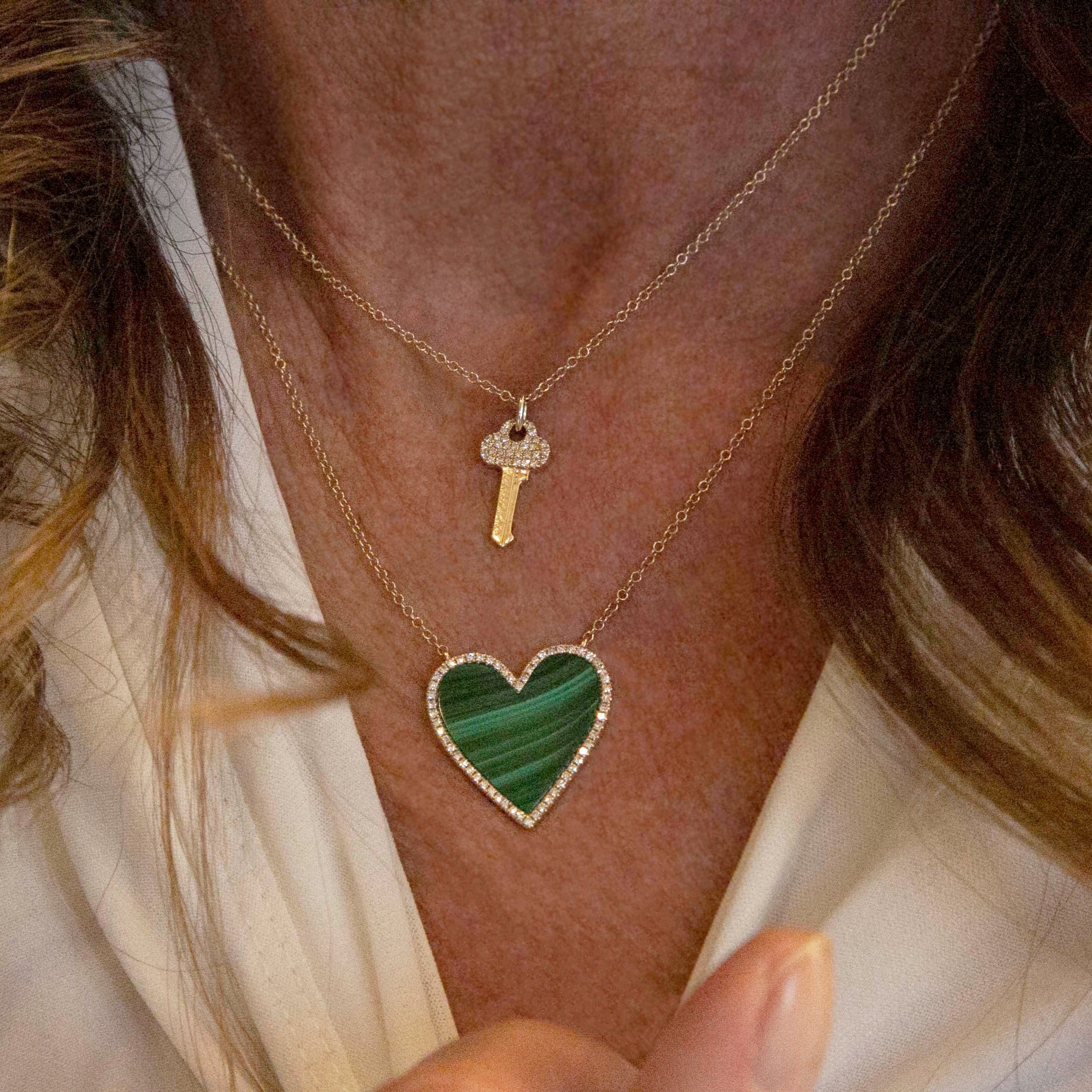 Pave Diamond Outline & Malachite Heart Chain Necklace  14K Yellow Gold 3.55 Malachite Carat Weight 0.18 Diamond Carat Weight Chain: 15-17" Length Heart: 0.80" Length X 0.75" Width