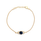 Blue Sapphire & Diamond Eye Bracelet  14K Yellow Gold 0.33 Blue Sapphire Carat Weight 0.77 Black & White Diamond Carat Weight Eye: 0.25" Long X 0.66" Wide 6-7" Adjustable Length