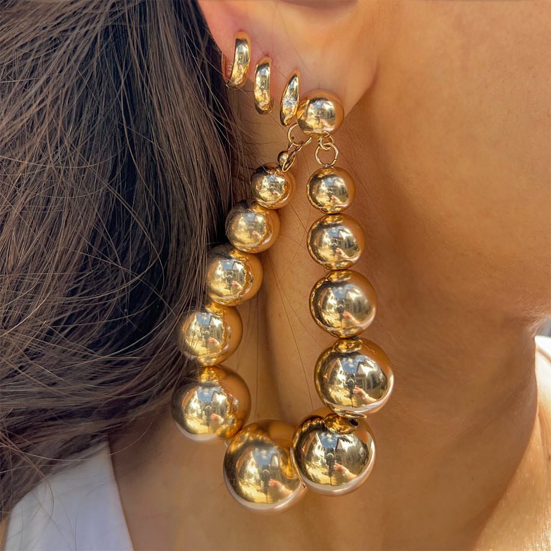 Single Diamond Thick Huggie Hoop Pierced Earrings  14K Yellow Gold 0.11 Diamond Carat Weight 0.5" Diameter 0.13" Thick