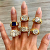 Woman's hand displaying gypsy ring collection