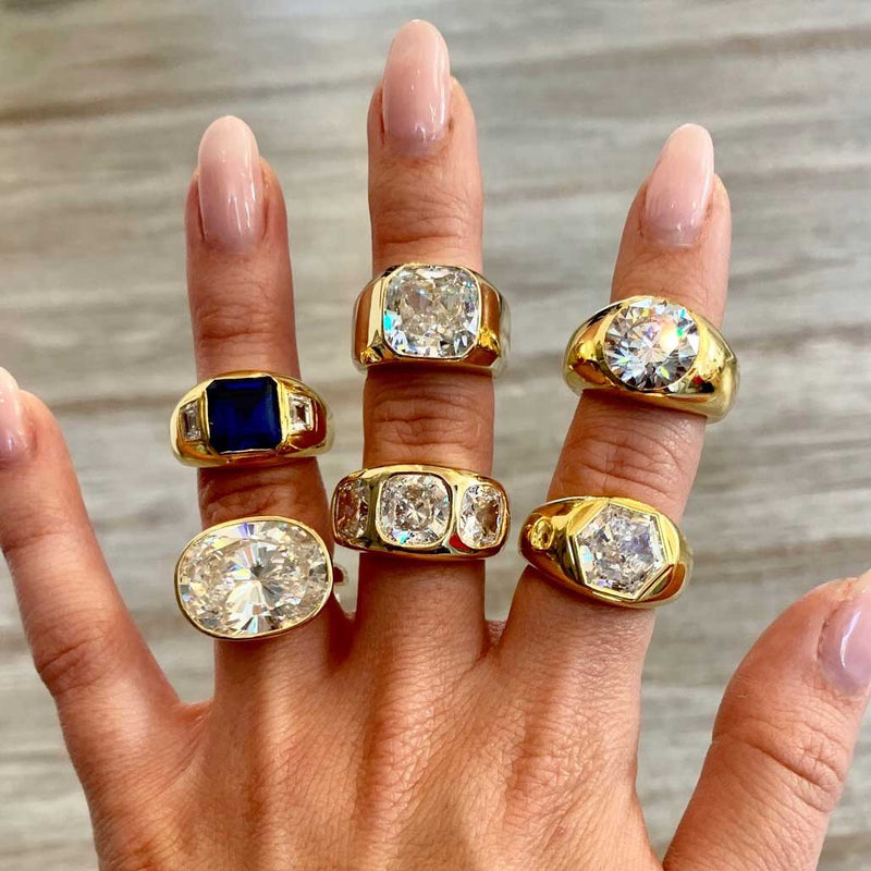Gypsy ring collection displayed on woman's fingers