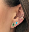 Diamond + turquoise circle earrings worn with emerald studs and yellow gold ear cuffs