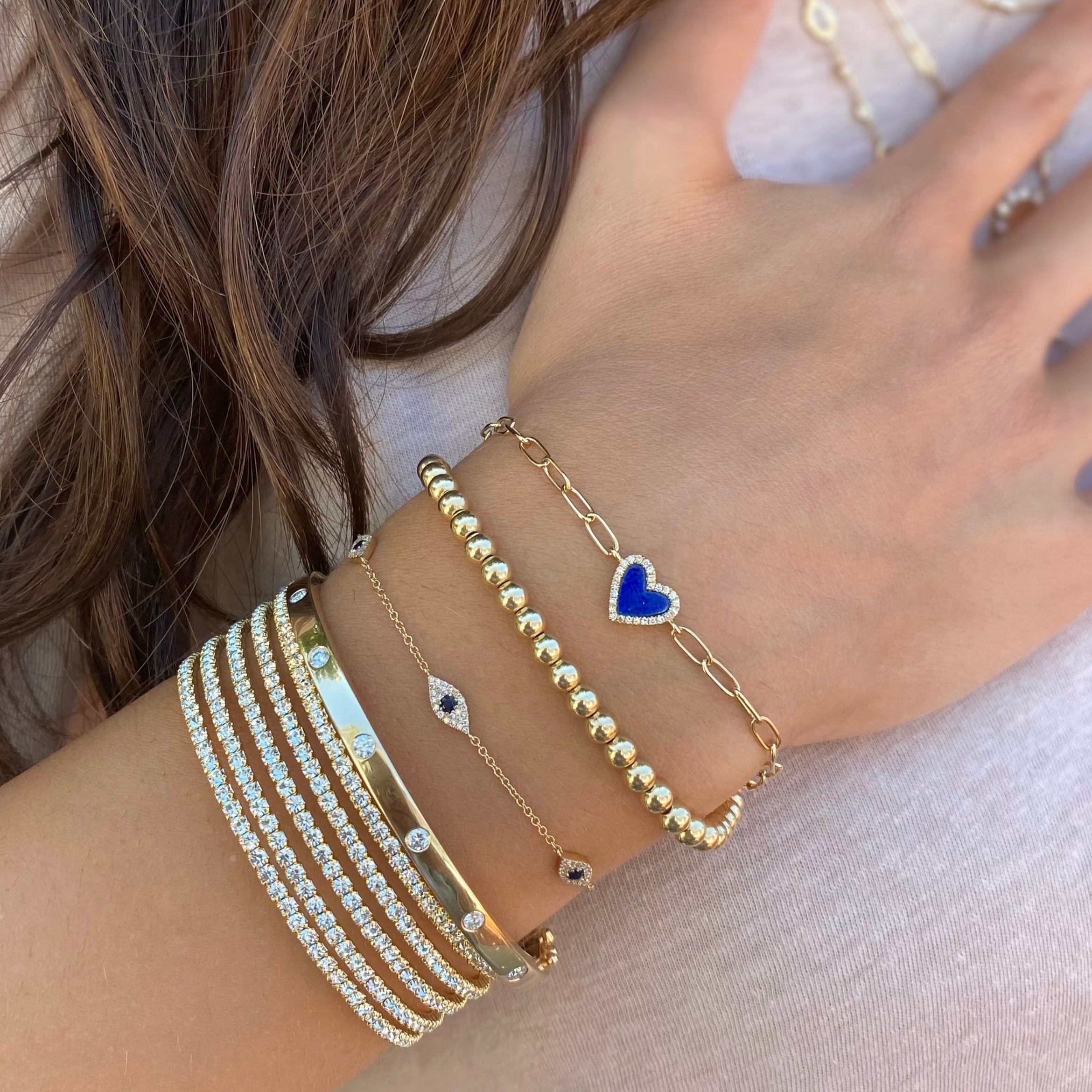 Yellow Gold Diamond & Lapis Heart Bracelet on a Paperclip Chain  14K Yellow Gold 0.06 Diamond Carat Weight 0.38 Lapis Carat Weight Chain: 6.5" Long Heart: 0.34" Diameter