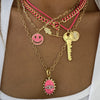 Gold Plated Neon Pink Enamel Smiley Face and CZ Hamsa Charm on Paperclip Chain Necklace  Yellow Gold Filled Smile: 0.78" Diameter Hamsa: 0.56" Long X 0.44" Wide Chain: 16" Long Worn layered with neon pink charm necklaces