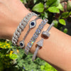 Diamond link bracelet with diamond evil eye and nail bracelets