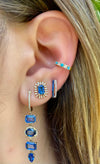model wearing diamond sapphire earrings