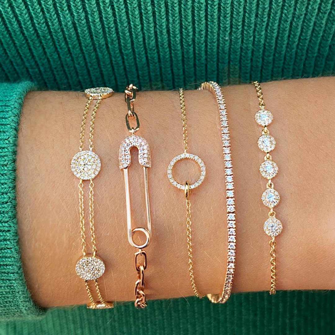 Diamond circle bracelet paired with yellow gold & diamond bracelets