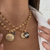 model wearing charm necklaces
