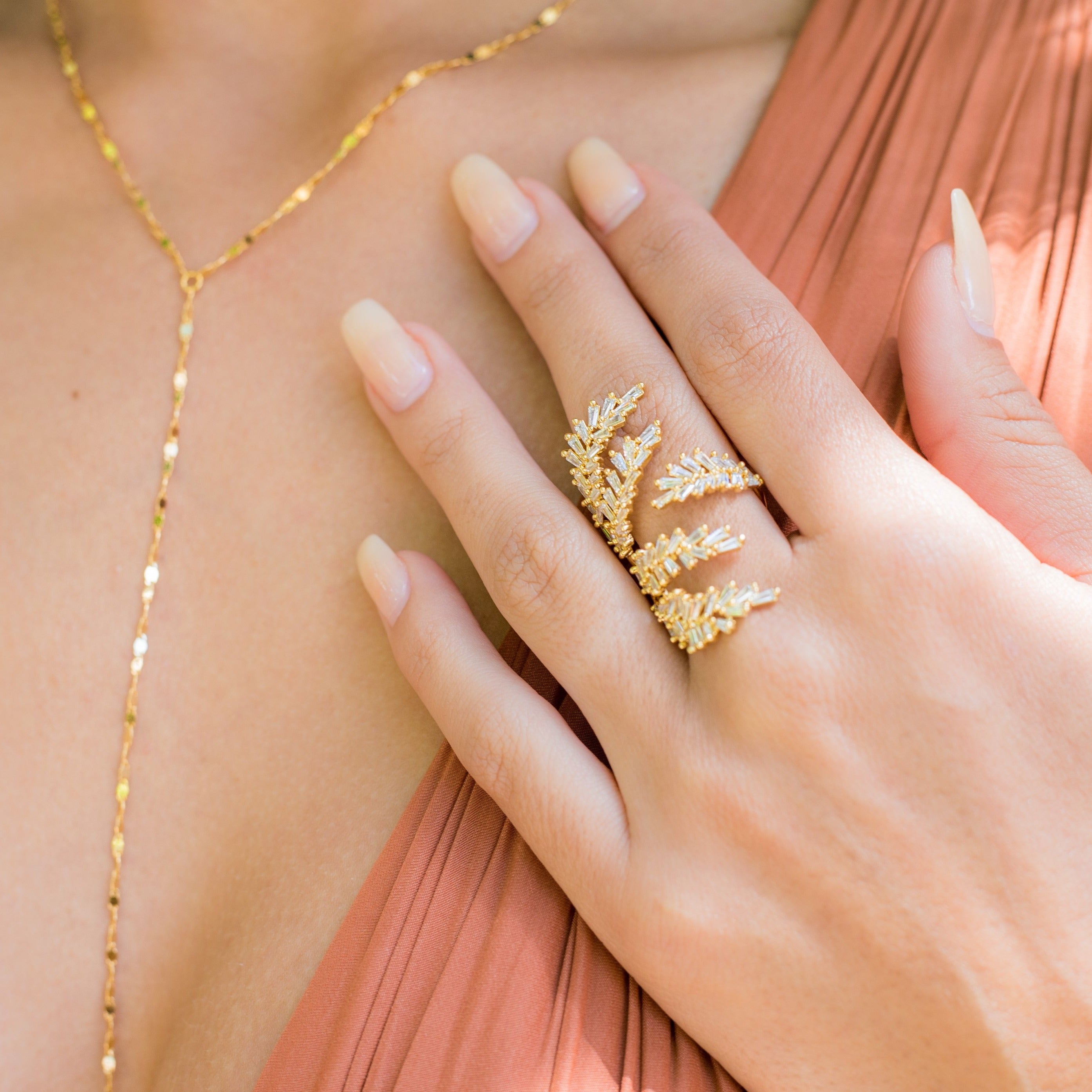 Leaf ring modelled with twinkle lariat necklace