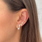 Pearl & Diamond V Earrings worn with yellow gold pave earring collection