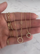 14K Gold Pave Diamond Open Circle on Mixed Chain Necklace  14K Yellow Gold 0.23 Diamond Carat Weight 18" Length Circle: 0.46" Diameter Paperclip Chains: 1.35" Length