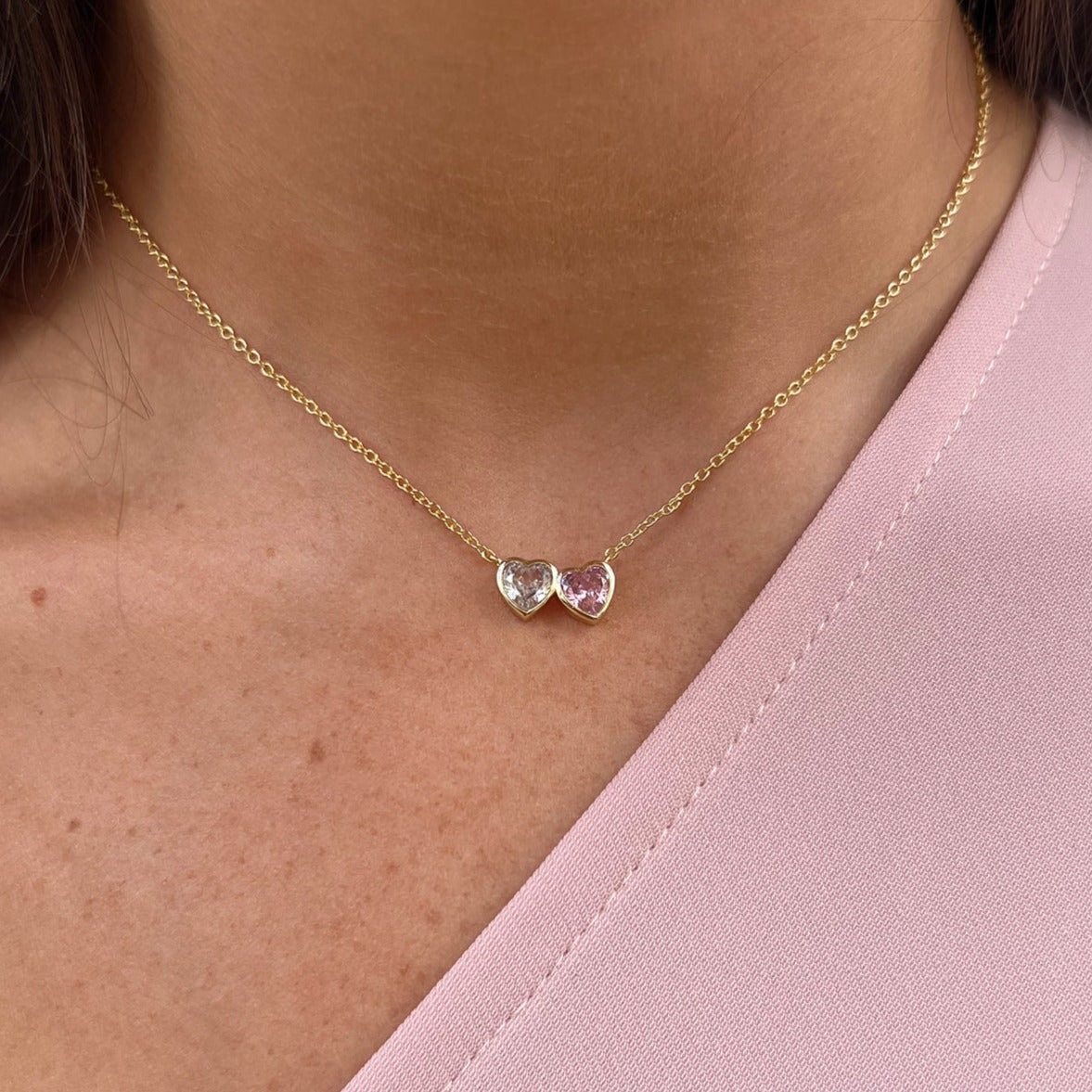 White and Pink CZ Double Heart Bezel Necklace  Yellow Gold Plated 13.5 - 18" Necklace Length  0.54" Length by 0.28" Width of Both Hearts