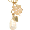 Four Leaf Clover Charm 14K Yellow Gold -Displayed on charm necklace with gold heart charm and large pearl
