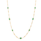 Diamond & Emerald Bezel Station Necklace   14K Yellow Gold  0.20 Diamond Carat Weight  1.10 Emerald Carat Weight Chain: 15-17" Length  Design: 9.25" Length 