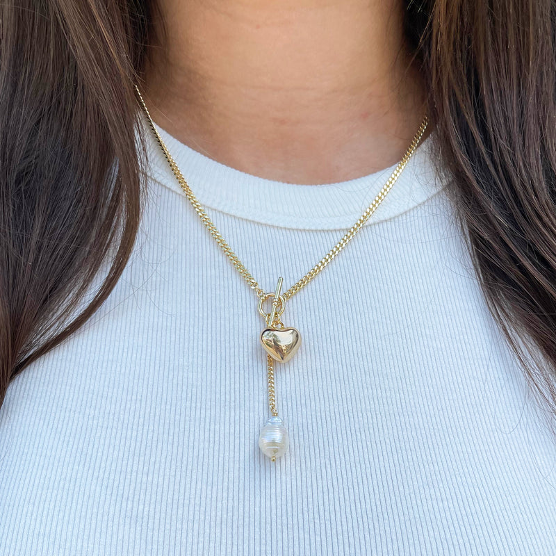 Yellow Gold Plated Heart & Pearl Toggle Necklace  Yellow Gold Plated Chain: 18" Long Drop Chain: 2" Long Heart: 0.50" Long X 0.60" Wide Freshwater Pearl: 0.60" Long X 0.40" Wide