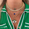 Pave Diamond & Lapis Double Heart Chain Necklace  14K Yellow Gold 0.16 Diamond Carat Weight 1.27 Lapis Carat Weight Pave Heart: 0.20 Diameter Lapis Heart: 0.50" Diameter Chain: 16-18" Length