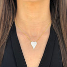 Girl wearing heart necklace