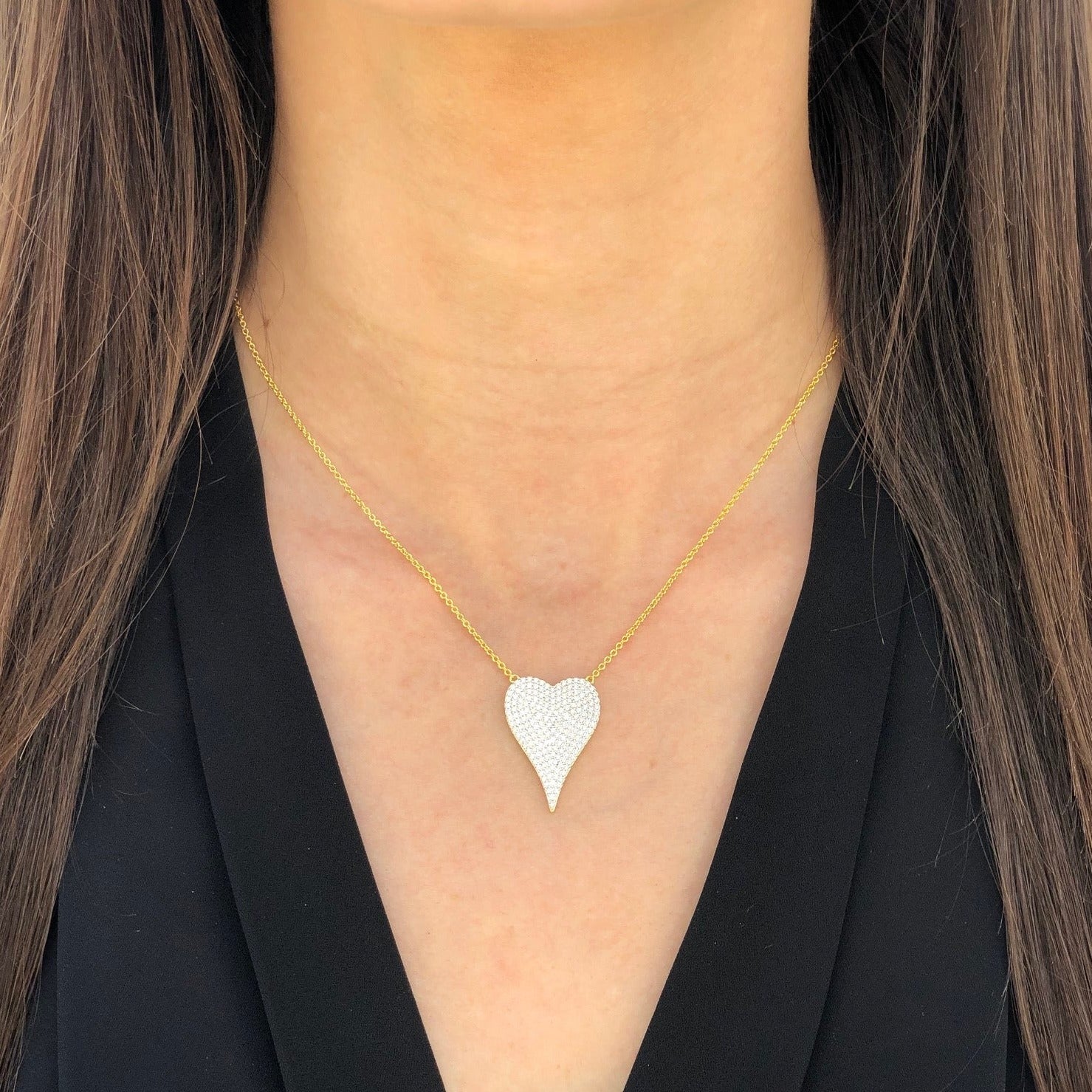 Girl wearing heart necklace