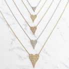 Pave diamond heart necklaces in yellow, rose, and white gold and small, medium, and large sizes